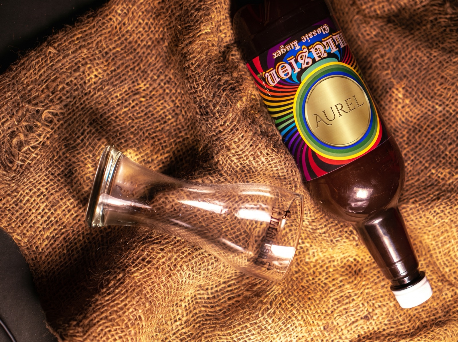 Amber bottle on burlap with a round custom label