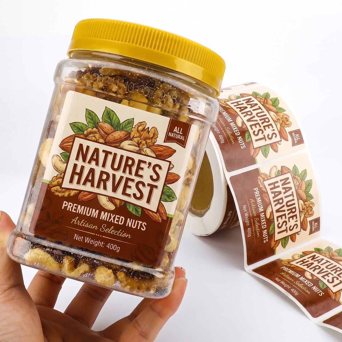 A food jar with a printed food-contact label beside its matching label roll