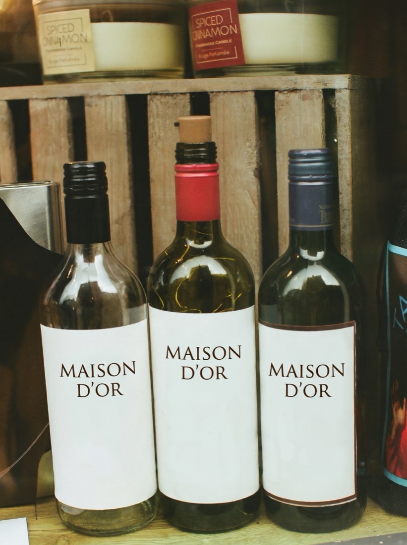 Wine bottles with custom estate labels in a wooden crate