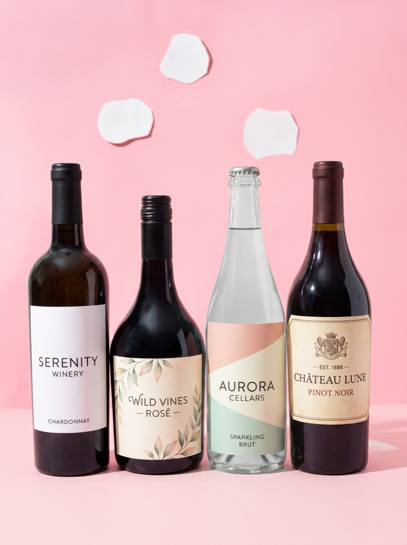 Four wine bottles each with a different custom winery label