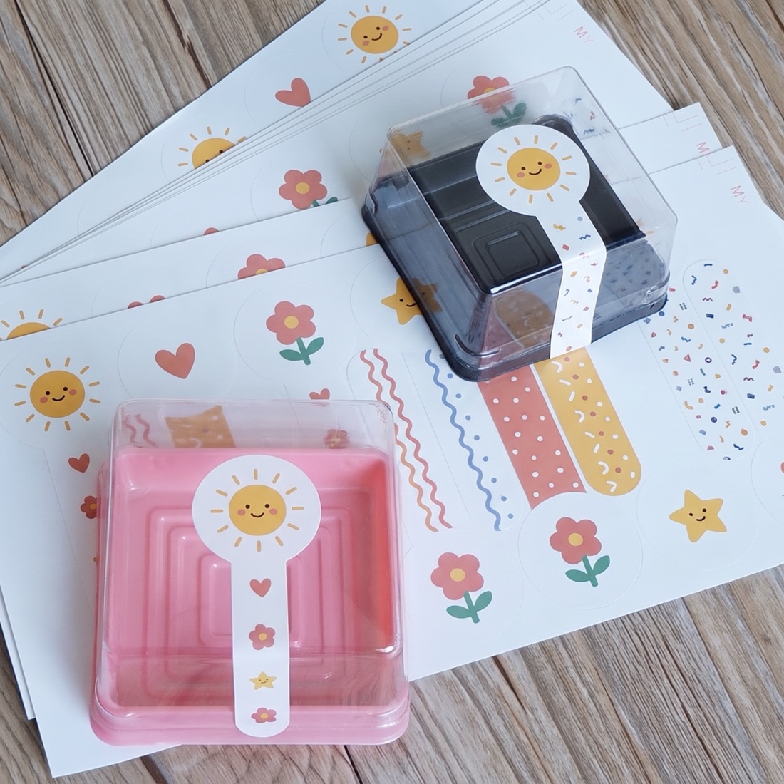 Custom die-cut vinyl stickers peeled and fanned out, printed by Euphora
